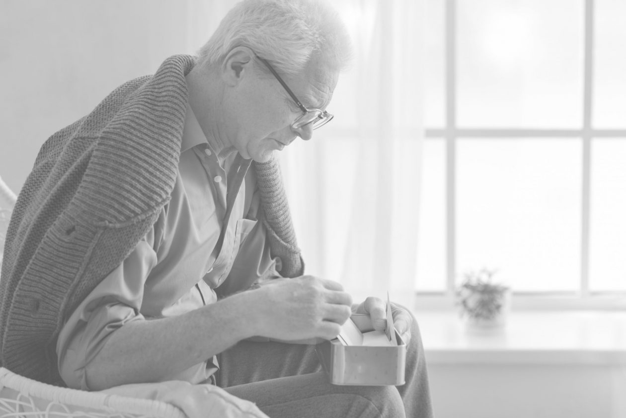 Senior citizen sorting through valuables with the support of CP&M LLP's trusted probate and estate administration services.